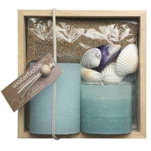 Wooden gift box with candles and shells